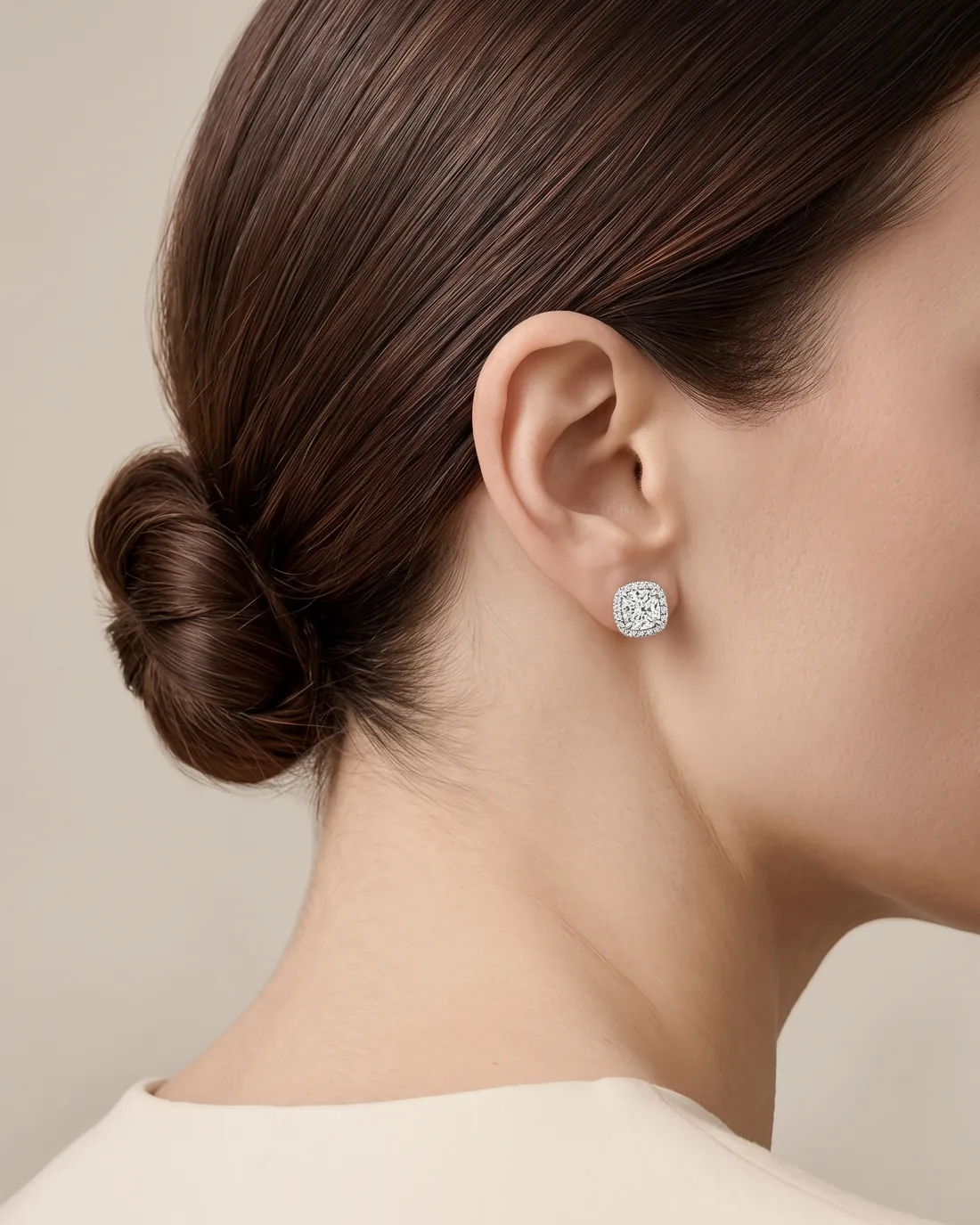 ORTIGAS Cushion Halo Studs earrings, worn on the ear