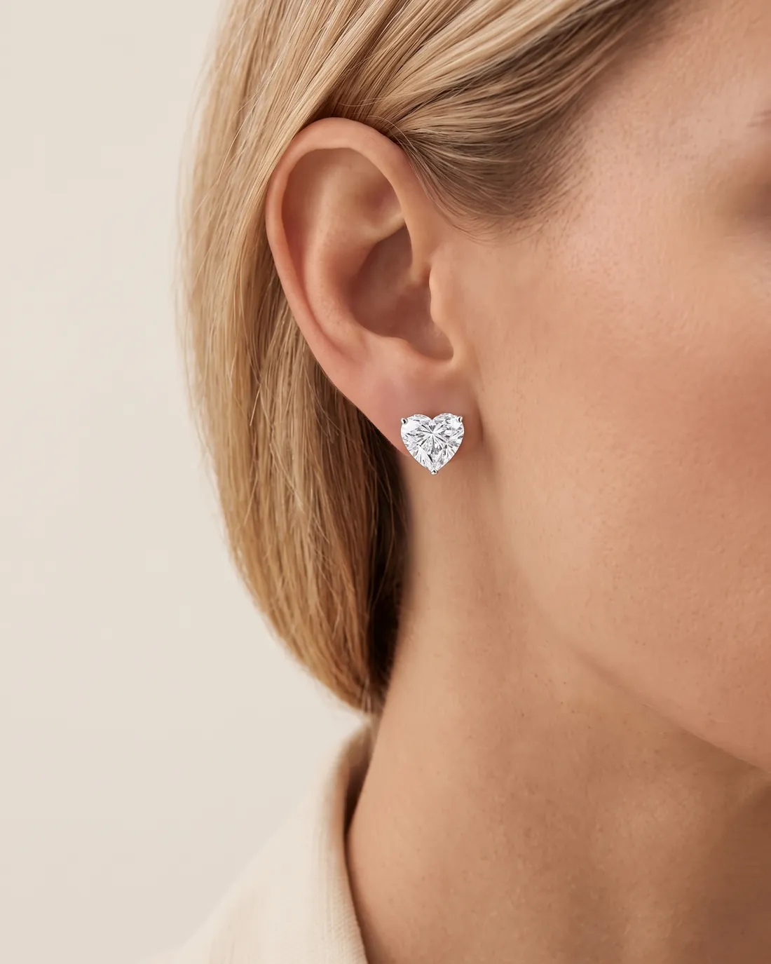 ORTIGAS Heart Studs earrings, worn on the ear