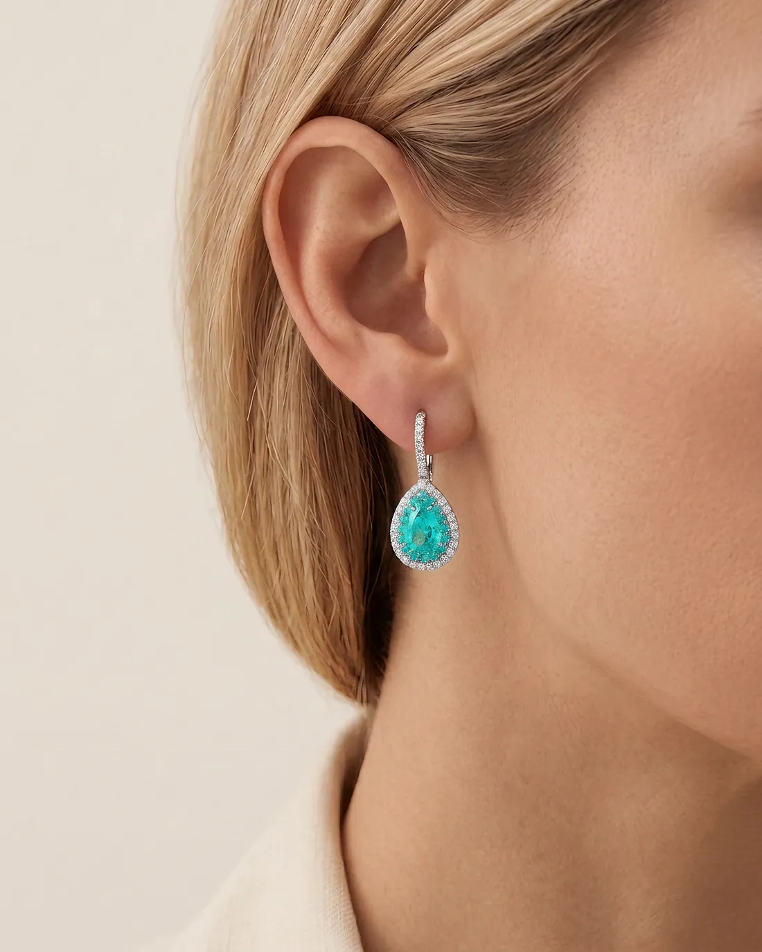 ORTIGAS Paraiba Pear Drops earrings, worn on the ear