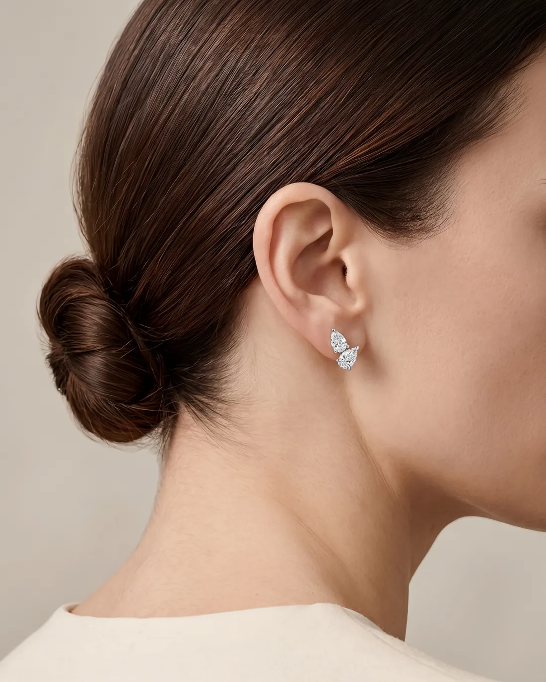 ORTIGAS Pear Climber earrings, worn on the ear