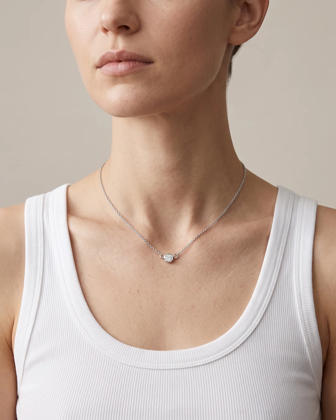 ORTIGAS Bezel Solitaire necklace, worn on the neck