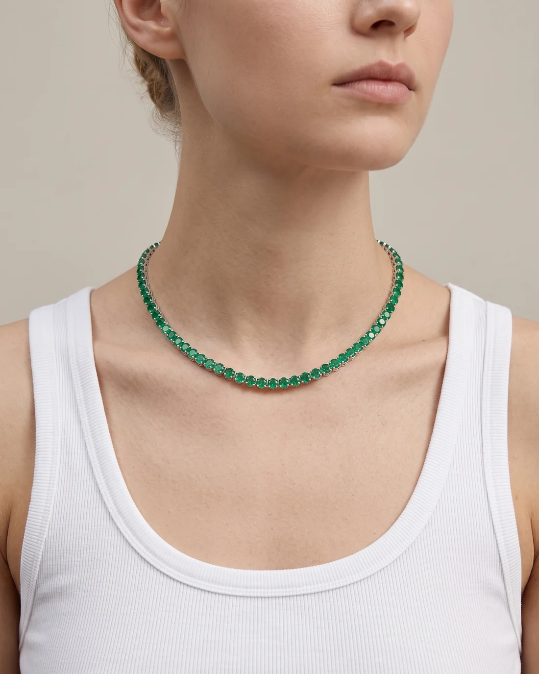 ORTIGAS Emerald Riviere necklace, worn on the neck