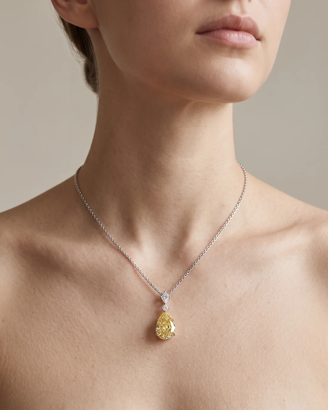 ORTIGAS Yellow Pear Drop necklace, worn on the neck