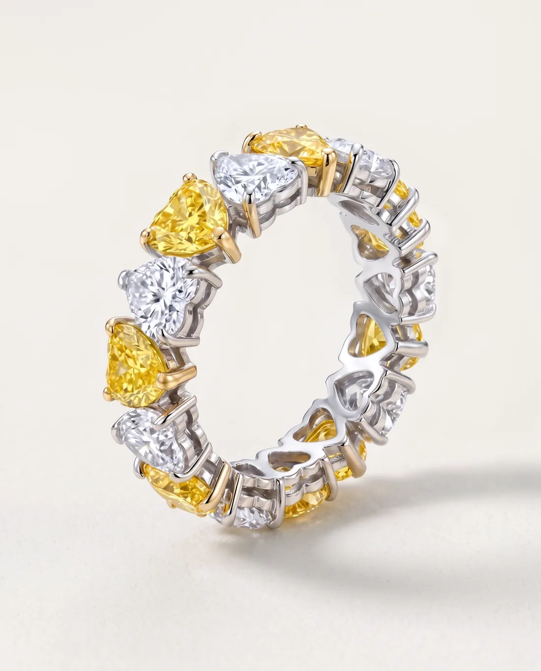 ORTIGAS Alternating Hearts ring, three-quarter view