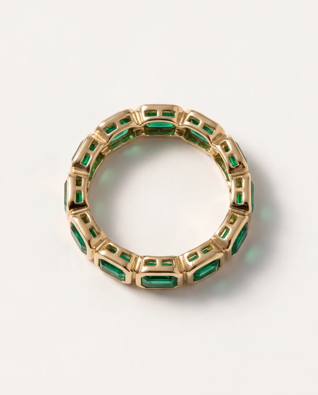 ORTIGAS Emerald Bezel Band ring, three-quarter view