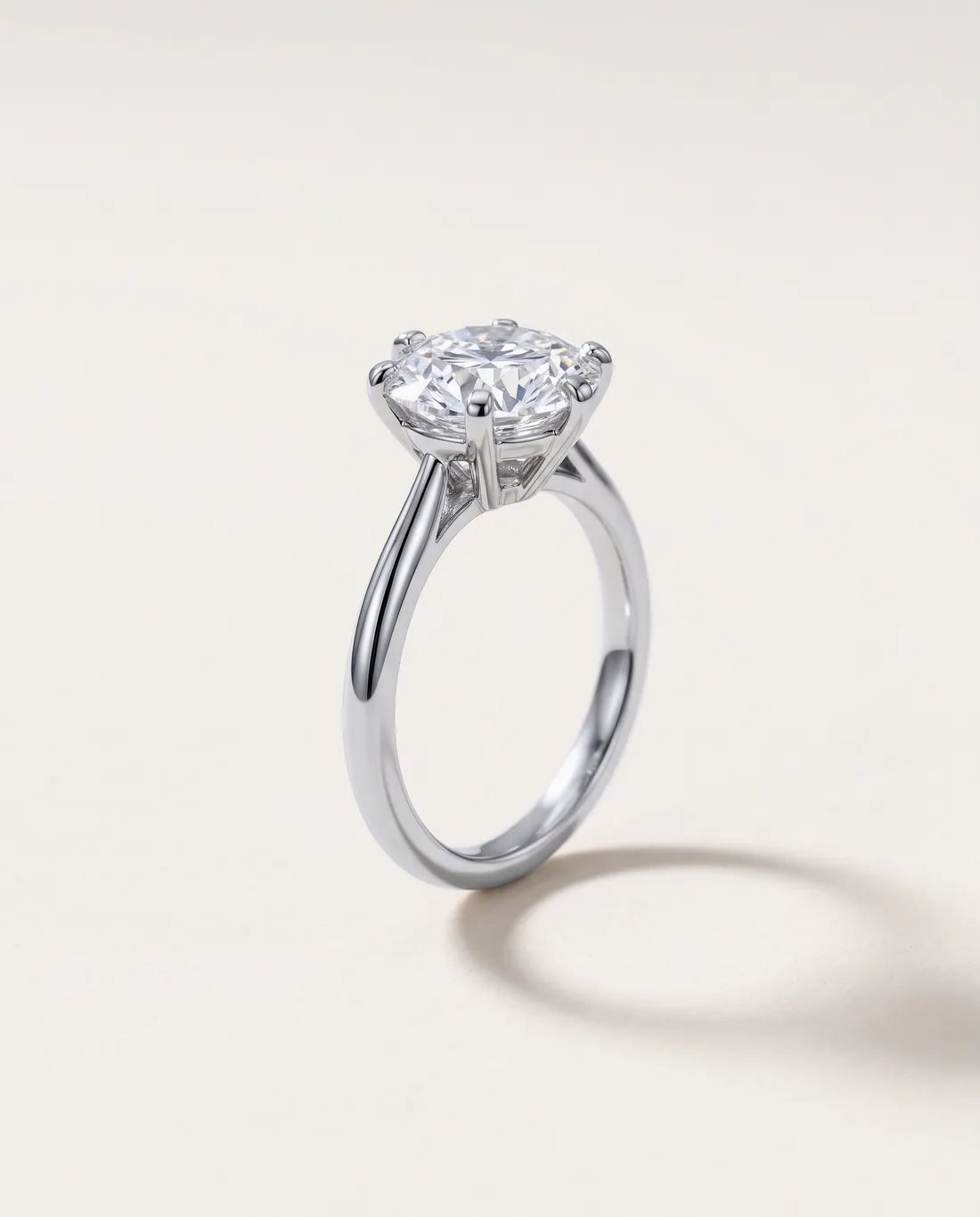 ORTIGAS Round solitaire ring, three-quarter view