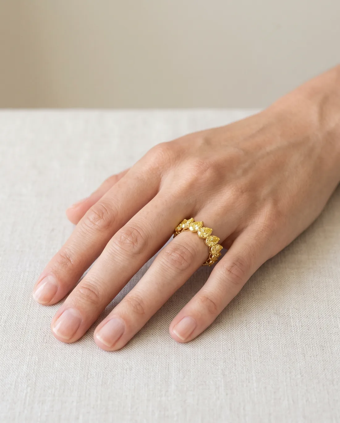 ORTIGAS Yellow Pear Eternity ring, worn on the hand